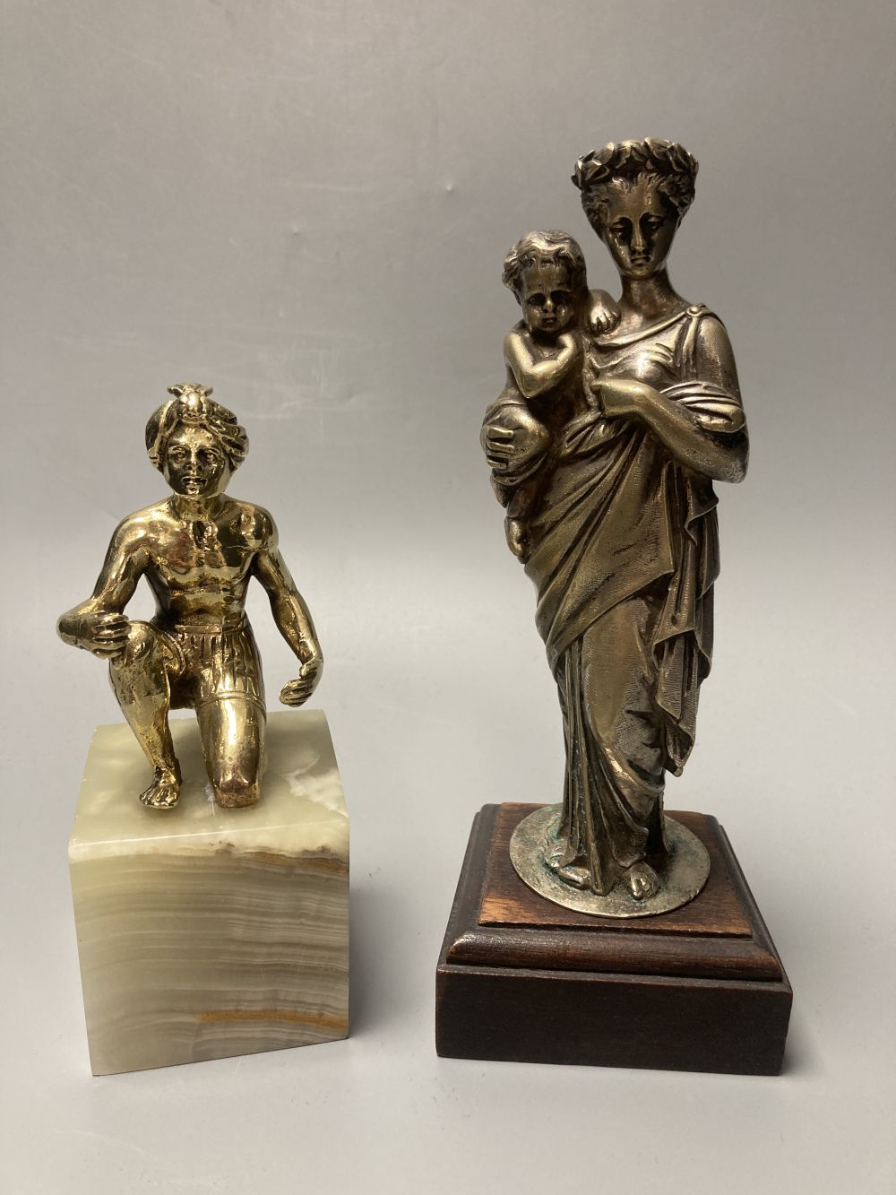 A silvered bronze figure of the Virgin and Mary, height 21cm and a similar tribal African seated gentleman